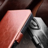 Fourre iPhone 16 Plus - Flip Qialino cuir véritable avec fermeture magnétique - Noir