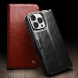 Fourre iPhone 16 - Flip Qialino cuir véritable avec fermeture magnétique - Noir